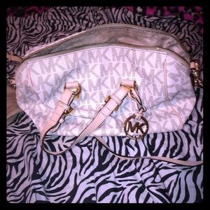 Mk bag needs some cleaning little stain on back